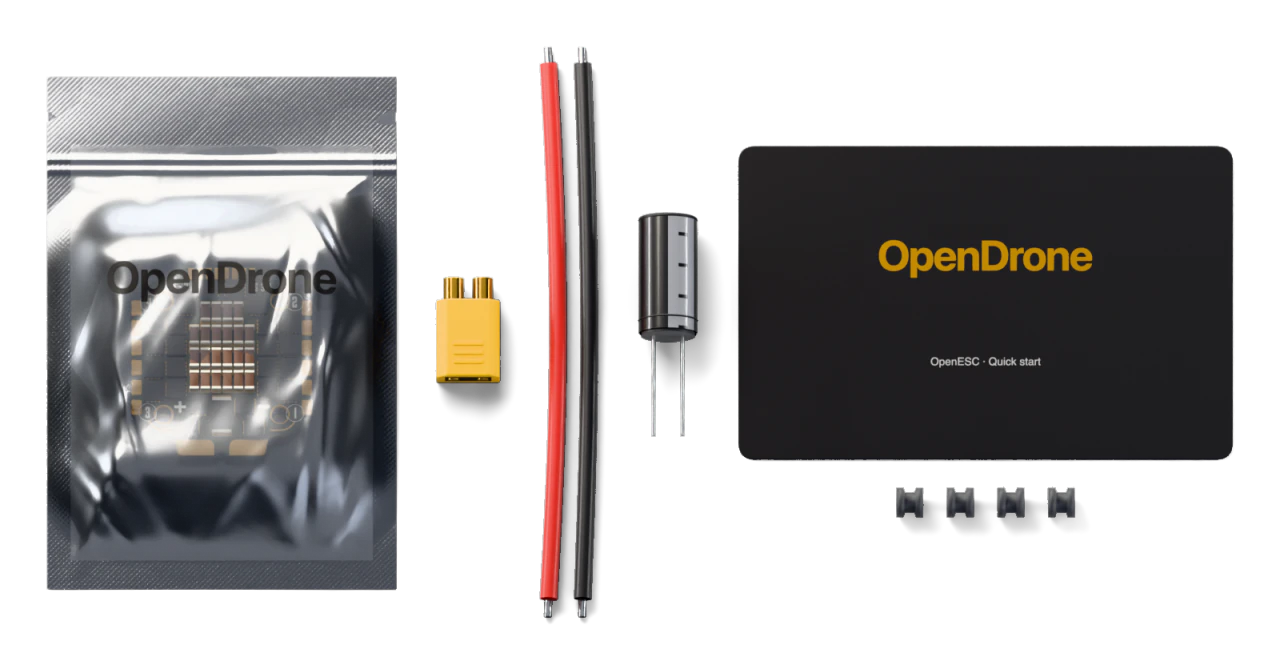 1× OpenESC board, 1× XT30 battery connector, ESC-side half, 2× Silicone power wire, 16 AWG, 100 mm, red and black, 1× Low-ESR electrolytic capacitor, 470 µF 35 V, 4× Silicone soft-mount grommets, M2, 1× Quick-start card, 1× ESD bag