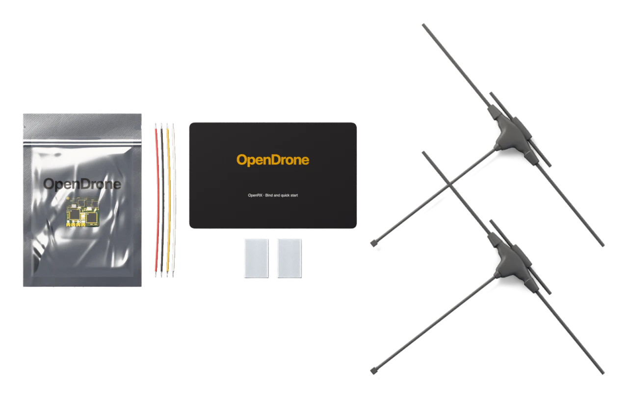 1× OpenRX board, 1× Silicone hook-up wire set, 30 AWG, four wires, 1× Heat-shrink sleeve, clear, two-piece, 2× 2.4 GHz + 900 MHz U.FL T-dipole antenna, 1× Bind and quick-start card, 1× ESD bag